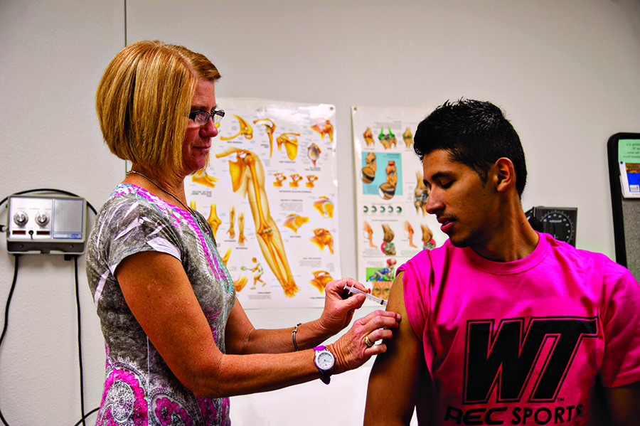 Student receiving immunization